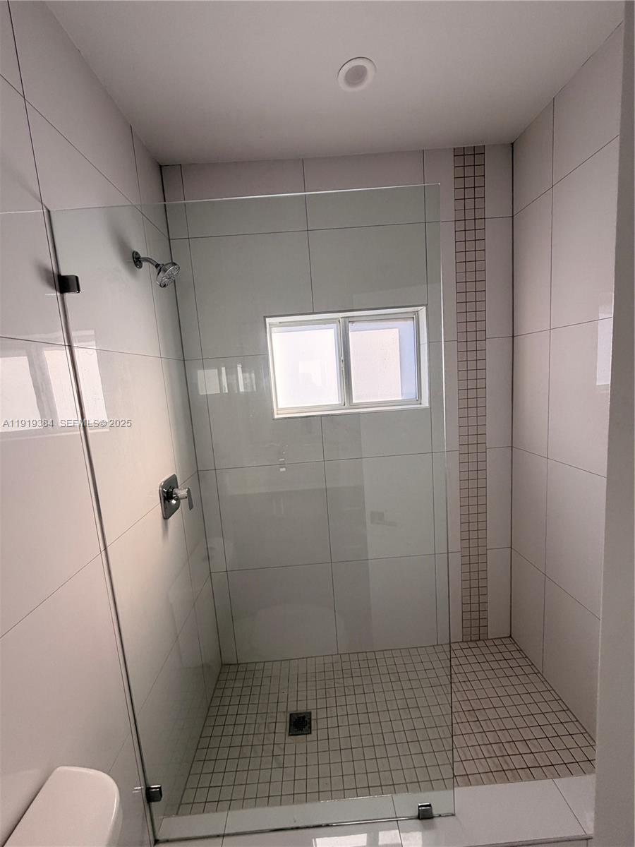 17334 Southwest 303rd Street Homestead, FL 33030 - Photo 21 of 34 a bathroom with a shower