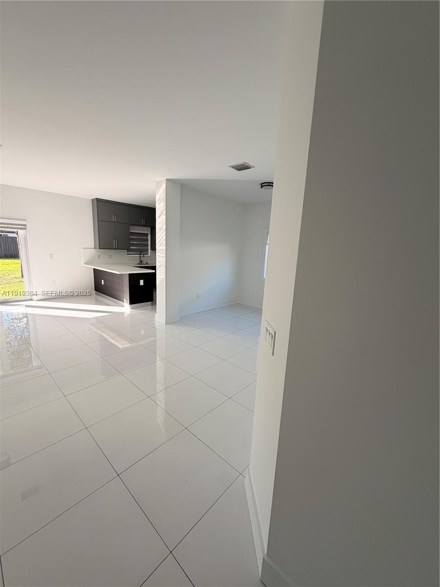 17334 Southwest 303rd Street Homestead, FL 33030 - Photo 24 of 34 a view of a livingroom with furniture and flat screen tv