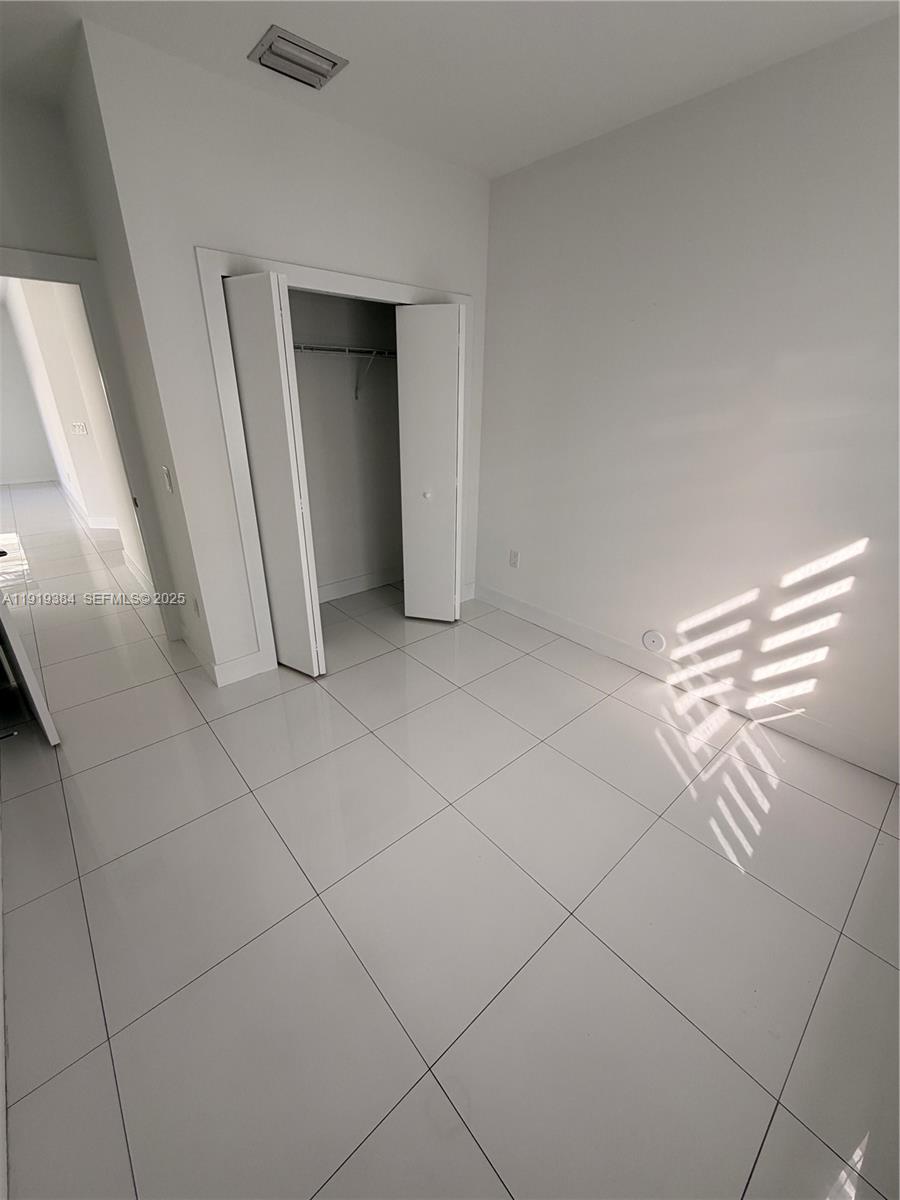 17334 Southwest 303rd Street Homestead, FL 33030 - Photo 26 of 34 a view of empty room with window