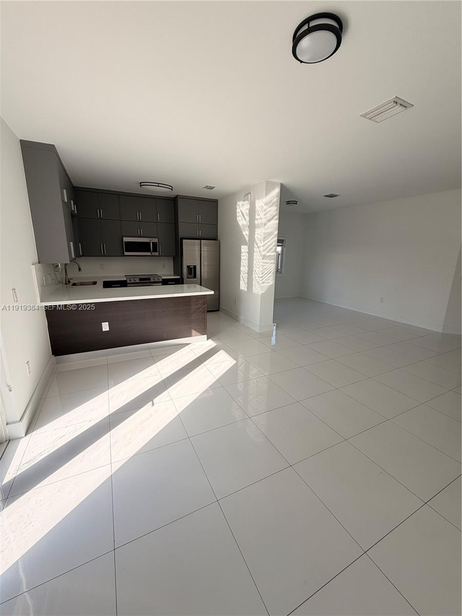 17334 Southwest 303rd Street Homestead, FL 33030 - Photo 30 of 34 a spacious bathroom with a tub and a sink