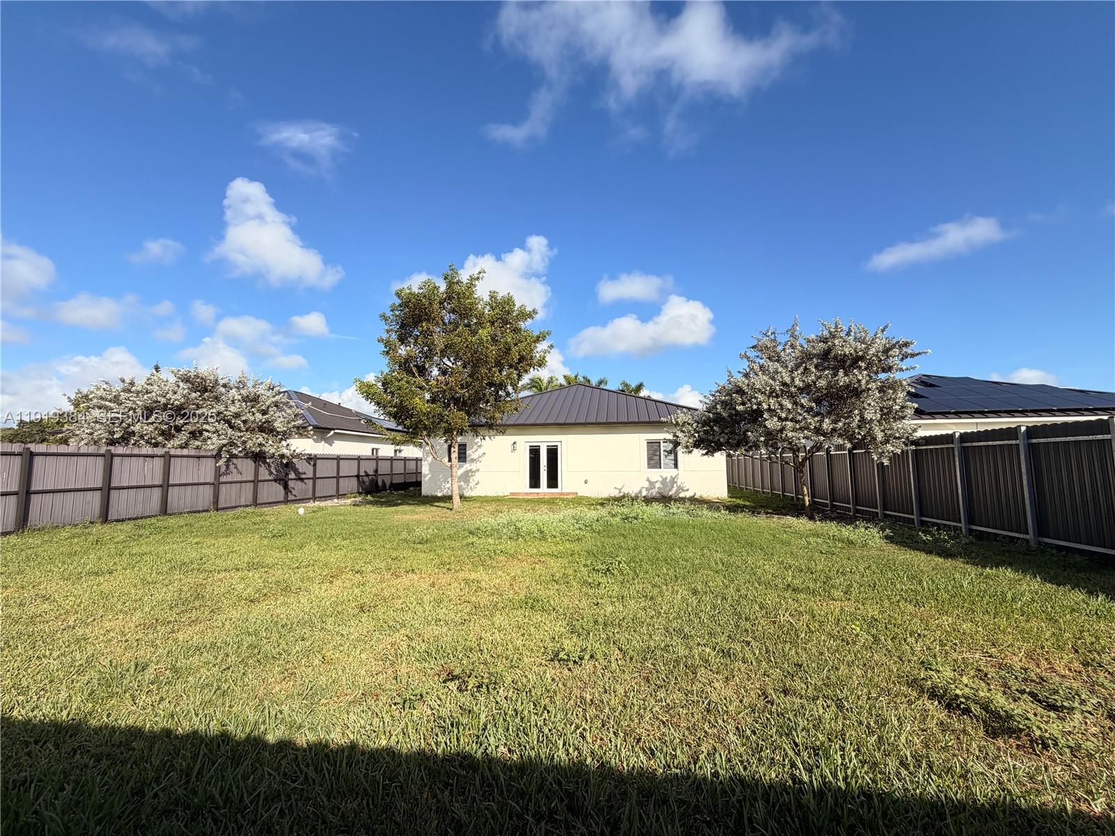 17334 Southwest 303rd Street Homestead, FL 33030 - Photo 32 of 34 a view of a yard in front of the house