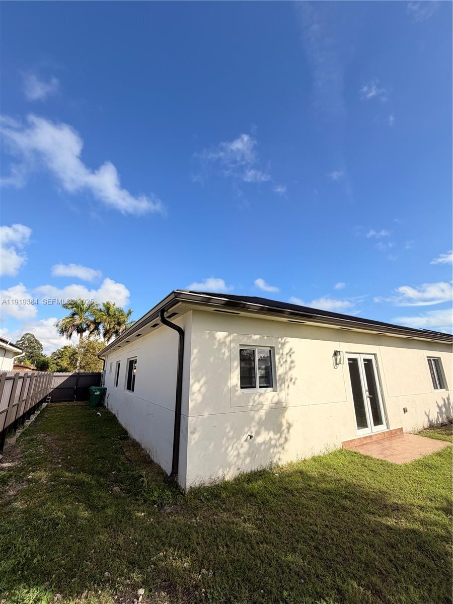 17334 Southwest 303rd Street Homestead, FL 33030 - Photo 33 of 34 a view of a back yard of the house