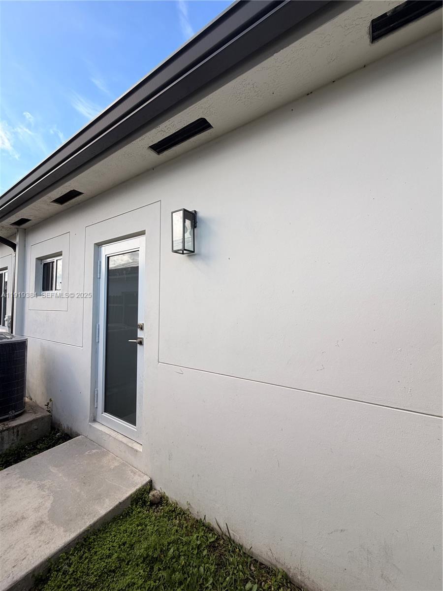 17334 Southwest 303rd Street Homestead, FL 33030 - Photo 34 of 34 a view of front door