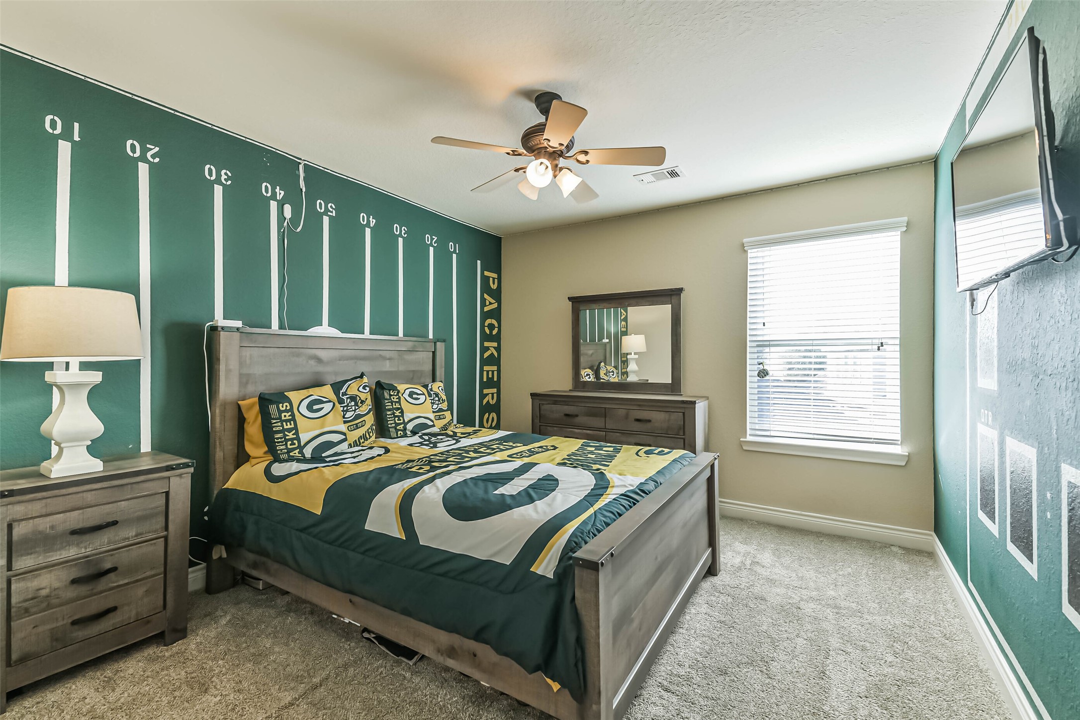 19022 Greenleaf Ridge Court Cypress, TX 77429 - Photo 37 of 47 a bedroom with a bed lamps and a large mirror