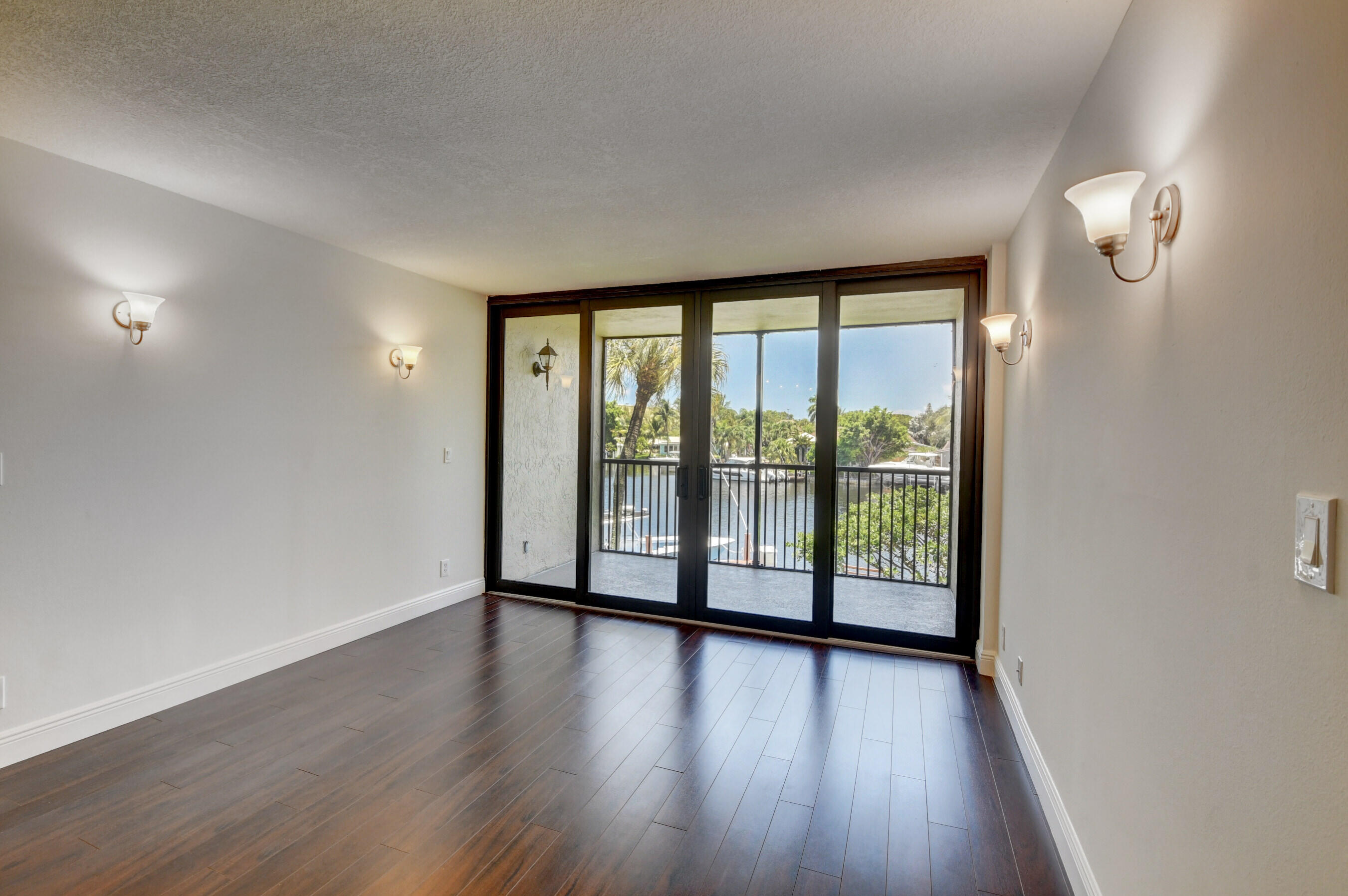 18 Royal Palm Way, Unit 202 Boca Raton, FL 33432 - Photo 14 of 51 wooden floor in an empty room with a window