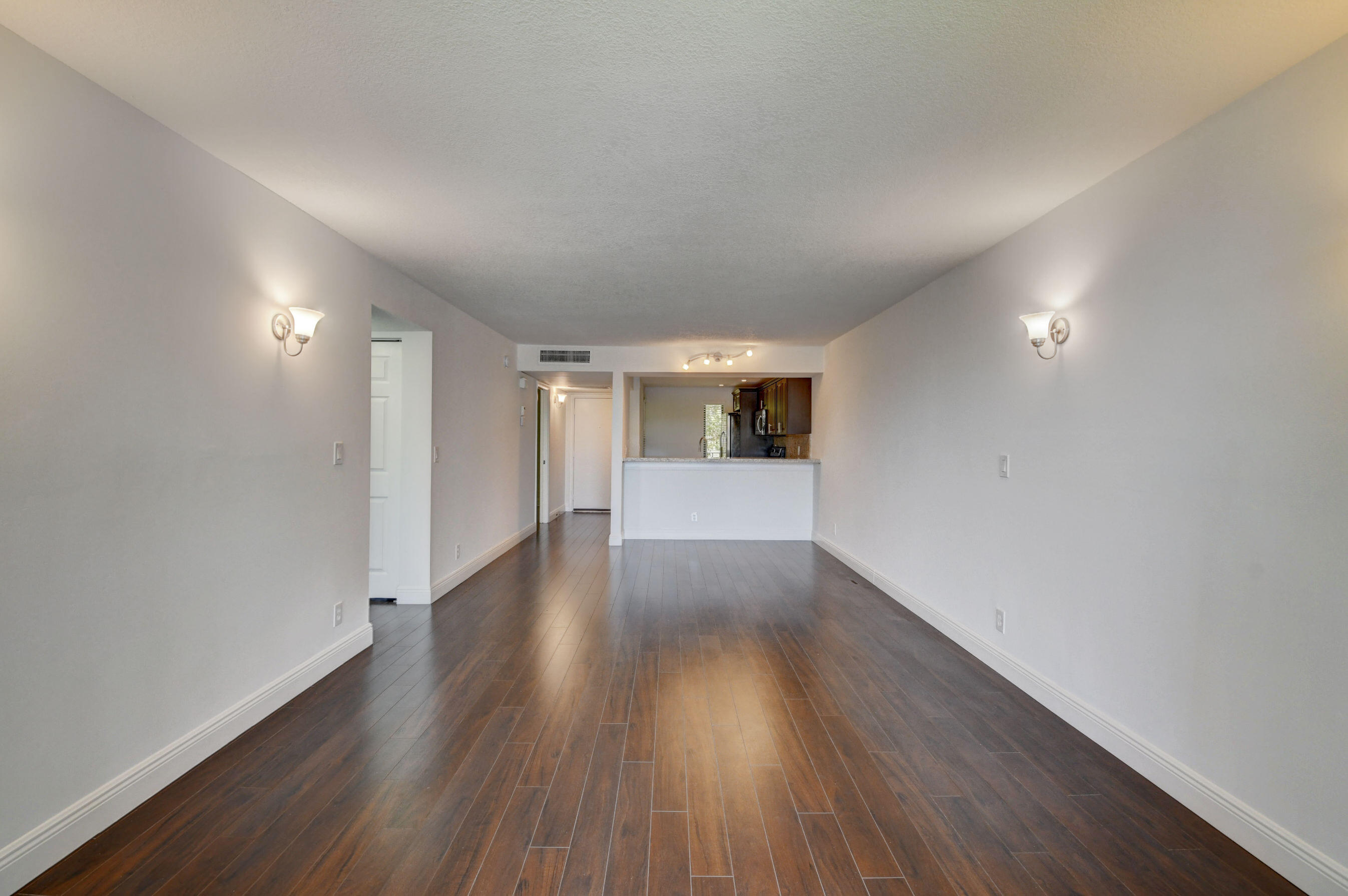 18 Royal Palm Way, Unit 202 Boca Raton, FL 33432 - Photo 16 of 51 a view of a hallway with wooden floor
