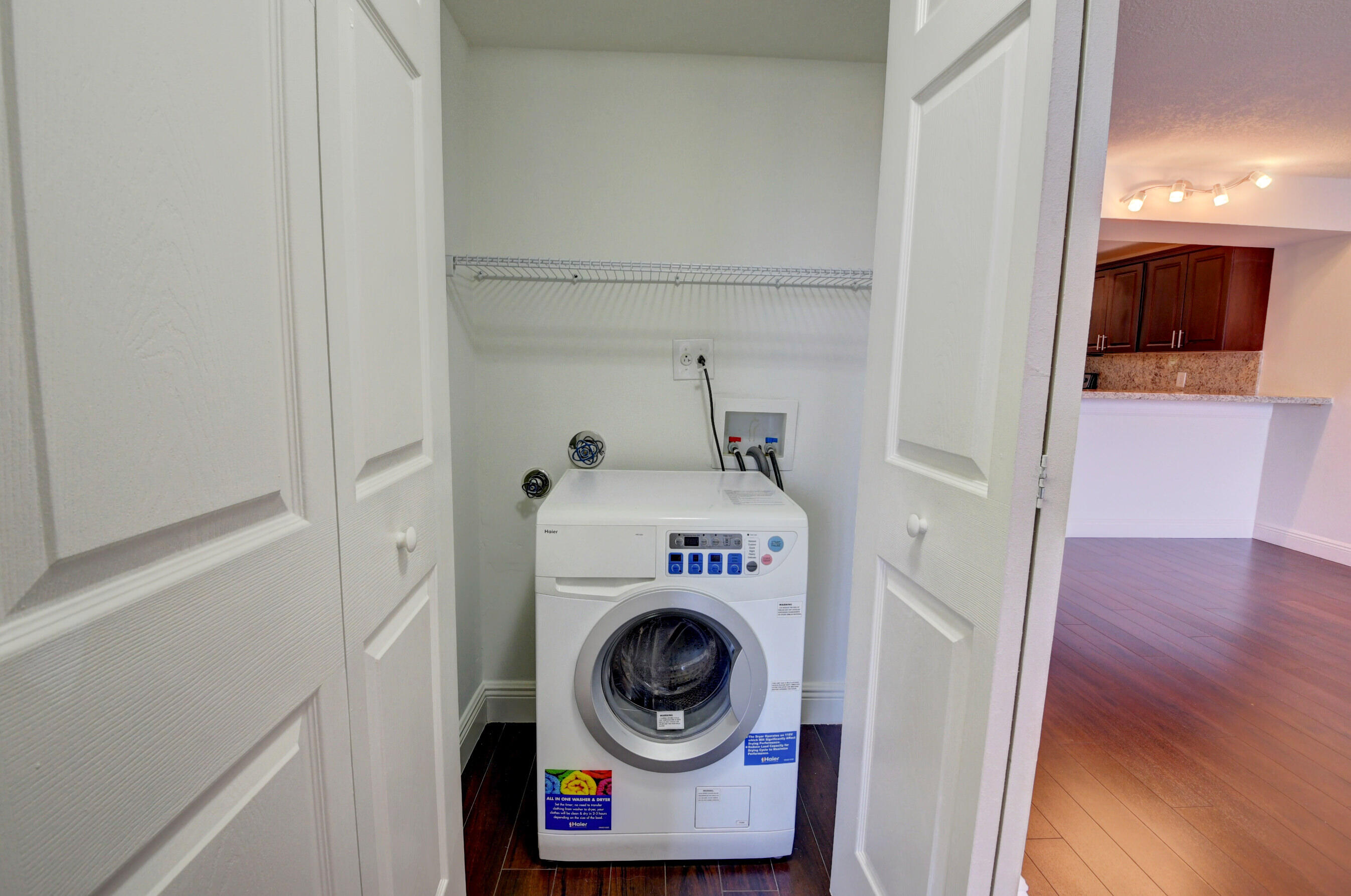 18 Royal Palm Way, Unit 202 Boca Raton, FL 33432 - Photo 18 of 51 a utility room with dryer and washer