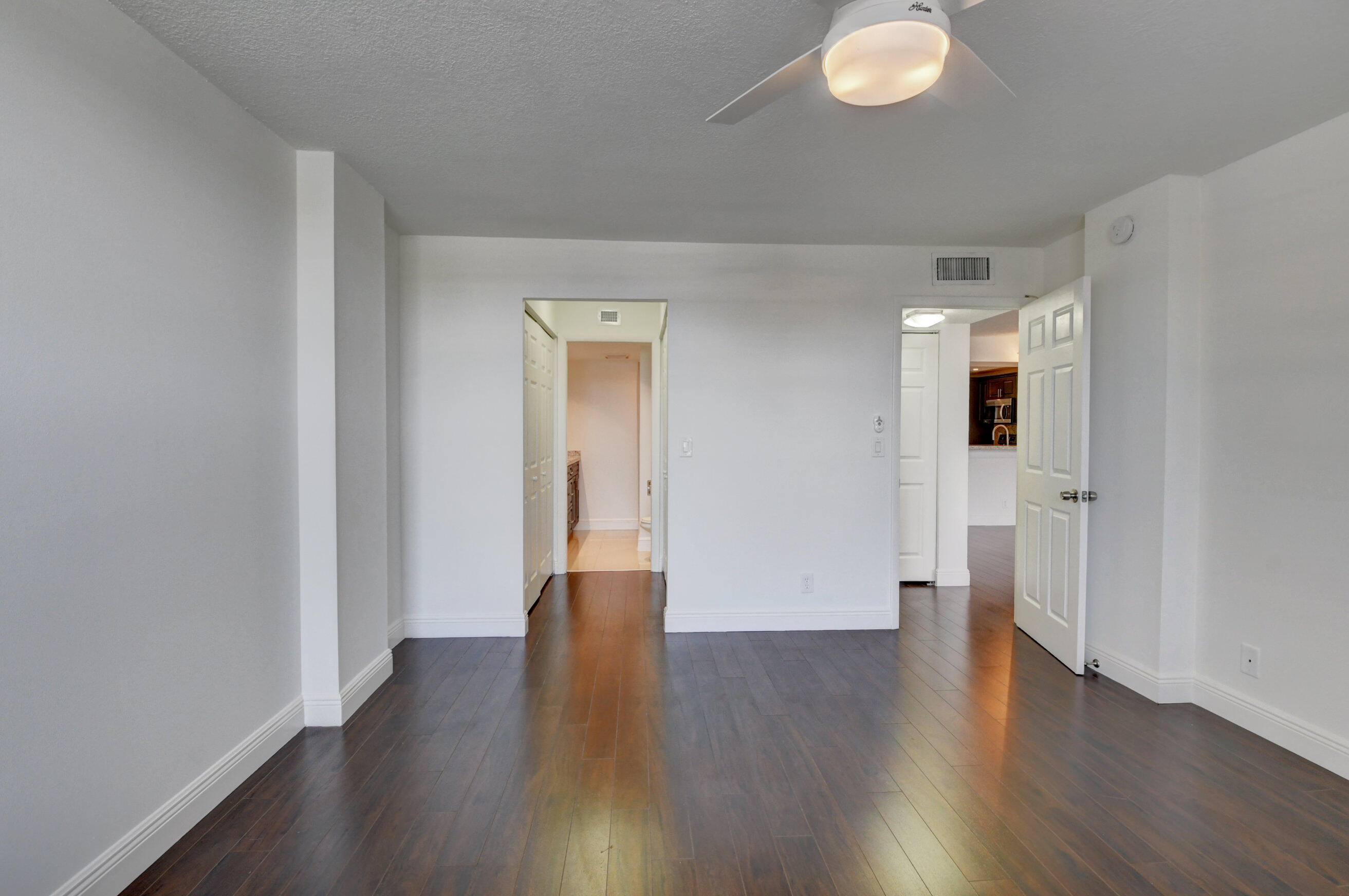 18 Royal Palm Way, Unit 202 Boca Raton, FL 33432 - Photo 21 of 51 a big room with wooden floor and windows