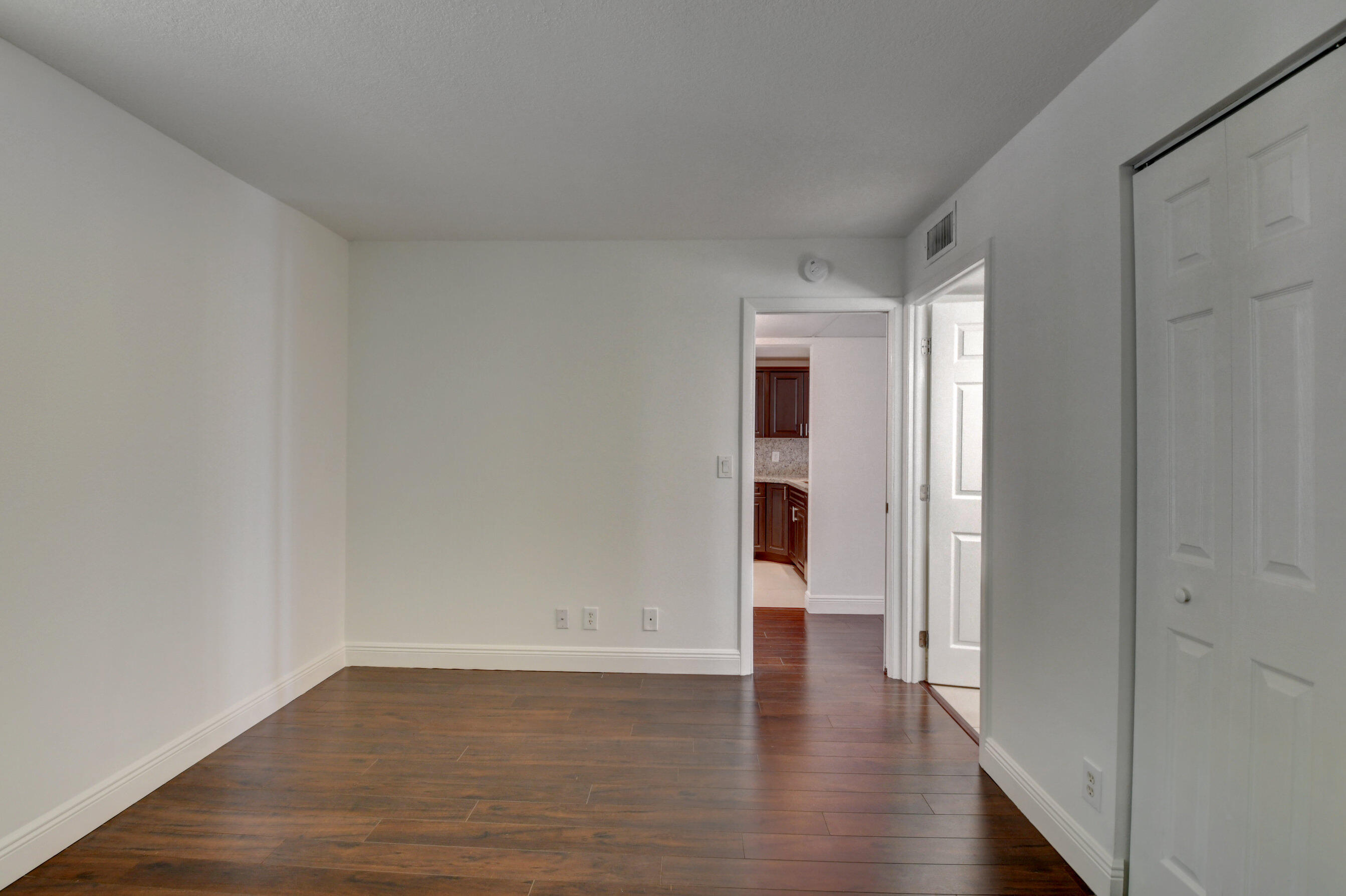18 Royal Palm Way, Unit 202 Boca Raton, FL 33432 - Photo 26 of 51 a view of an empty room and wooden floor