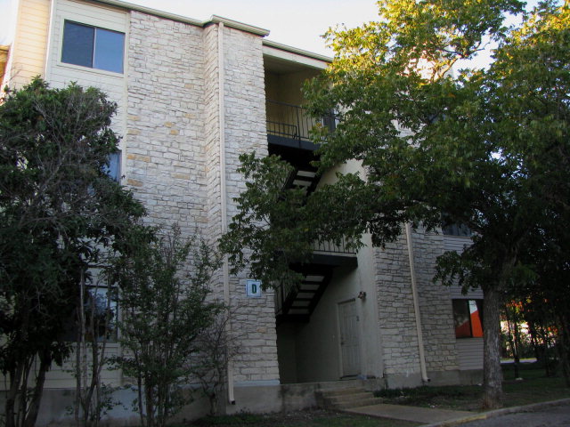 1013 Chestnut Street, Unit D6 San Marcos, TX 78666 - Photo 1 of 1 a front view of a house with plants