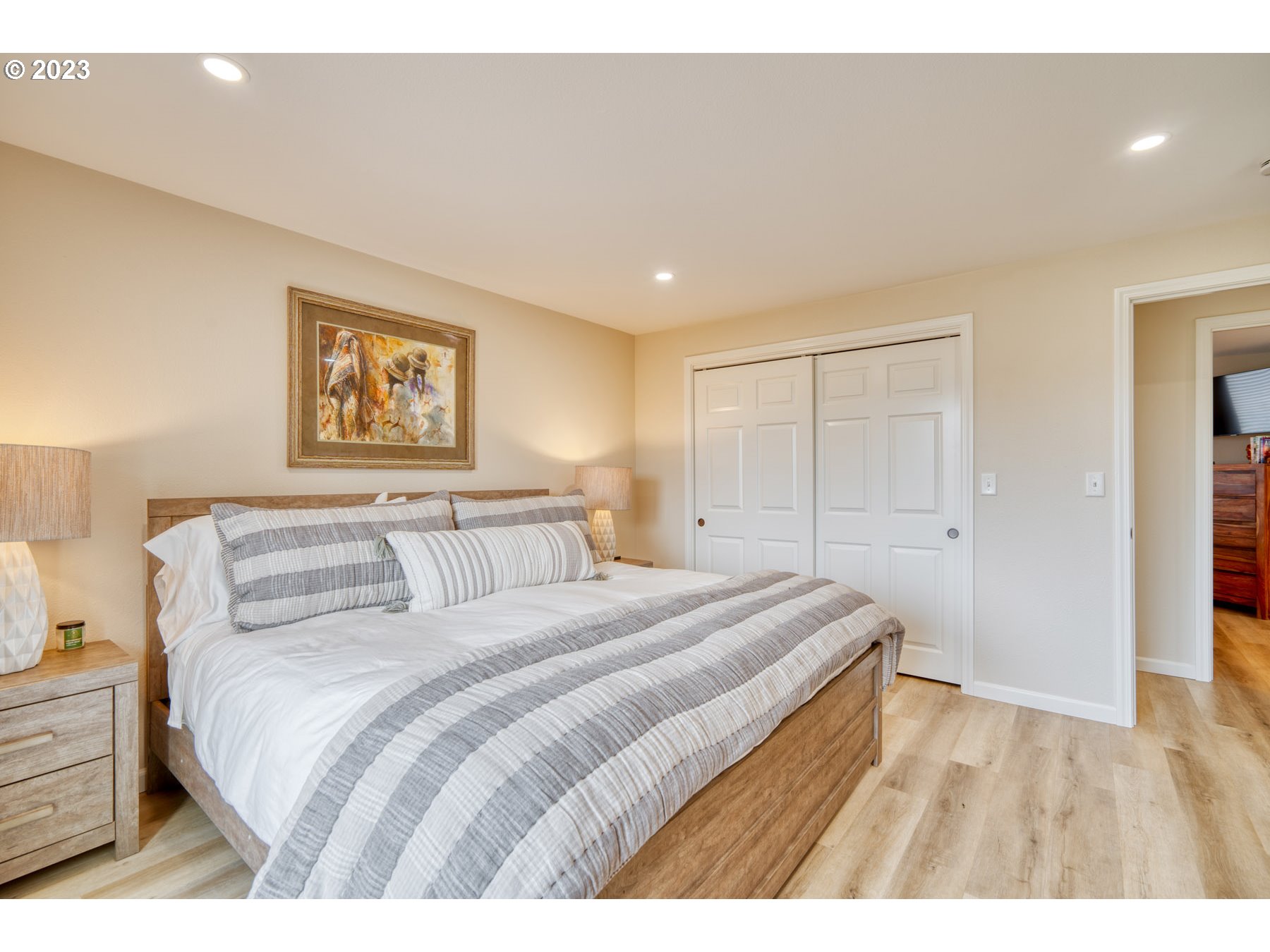 12101 Southwest River Road Hillsboro, OR 97123 - Photo 14 of 37 a bedroom with a bed and a painting on the wall