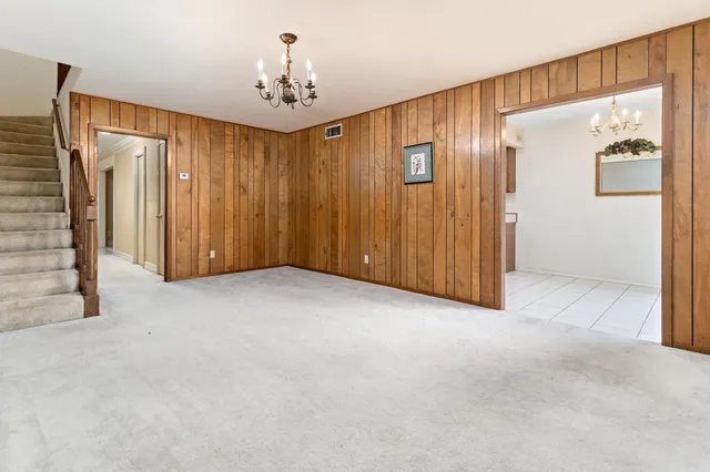 a kitchen with stainless steel appliances granite countertop a sink and a stove