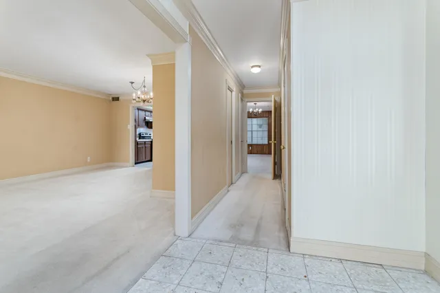 a view of an empty room with a mirror