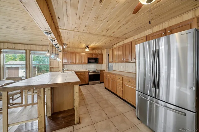 a kitchen with a refrigerator and countertop