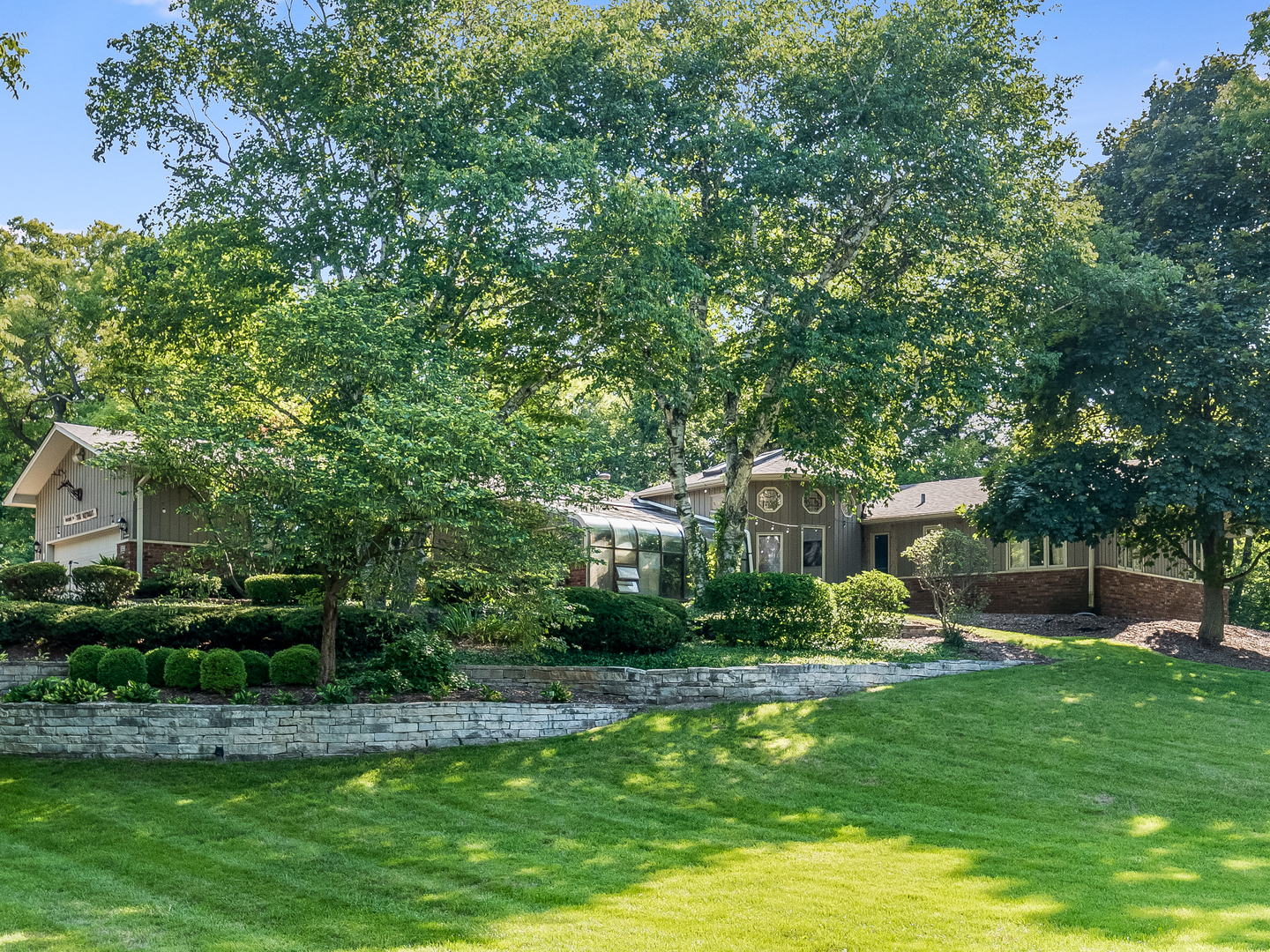 a view of a house with a yard porch and sitting area