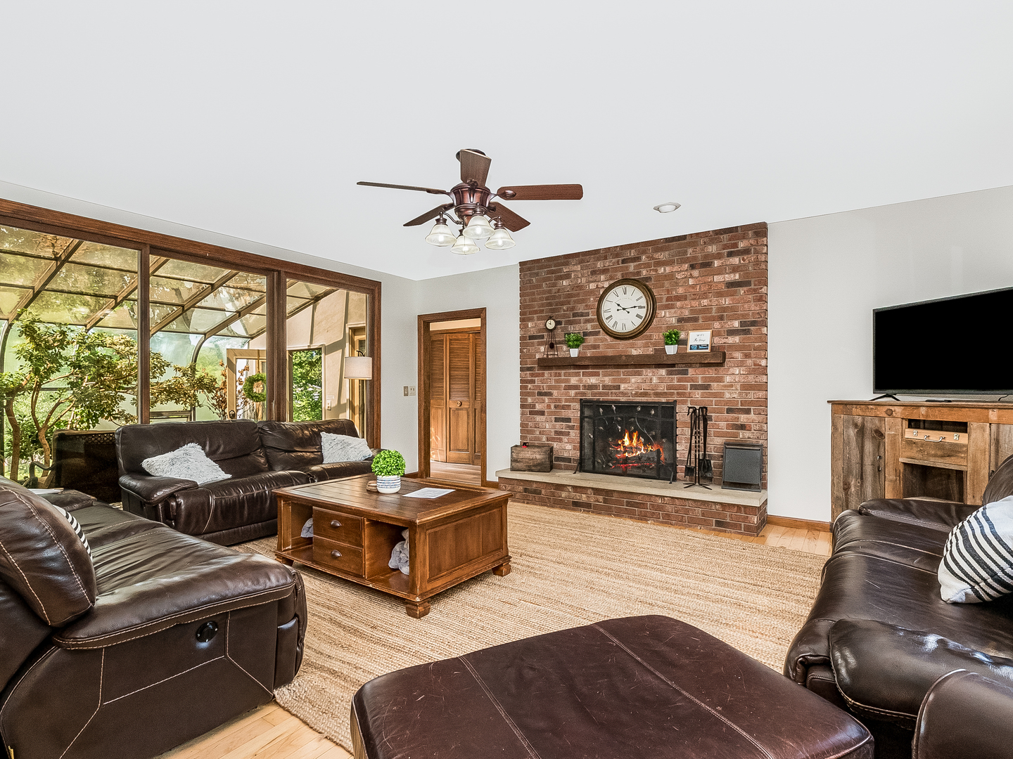 41W558 Farview Road Elburn, IL 60119 - Photo 25 of 50 a living room with furniture a fireplace and a flat screen tv