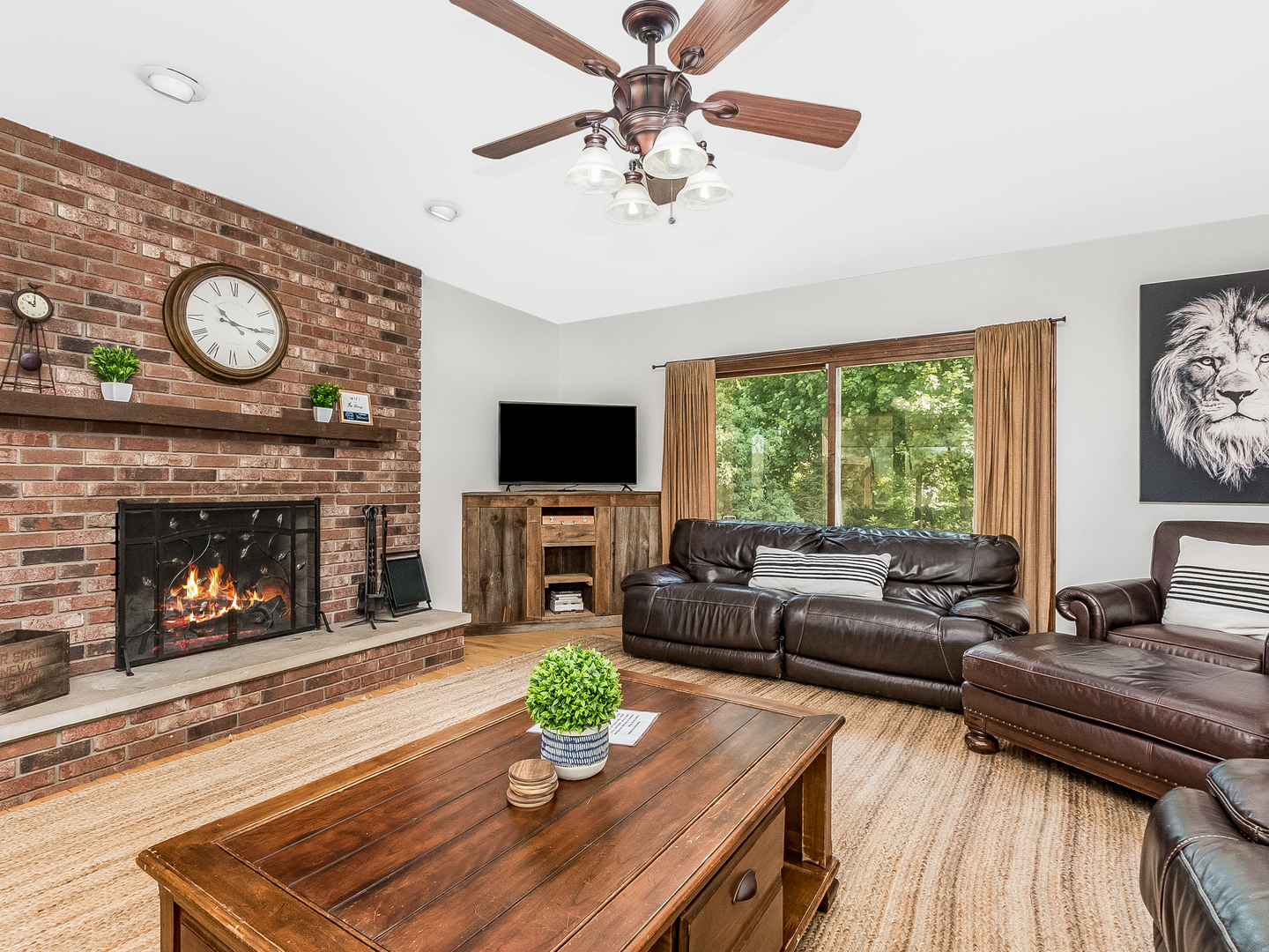 41W558 Farview Road Elburn, IL 60119 - Photo 28 of 50 a living room with furniture a fireplace and a flat screen tv