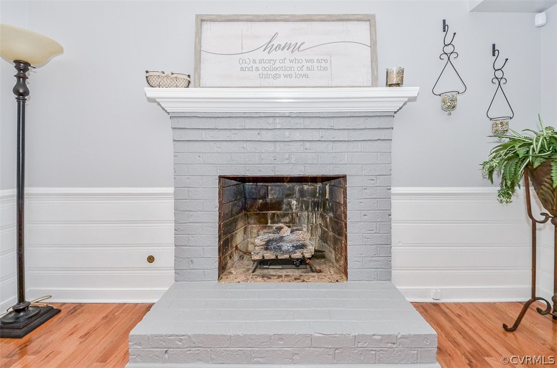 507 Watch Hill Road Midlothian, VA 23114 - Photo 12 of 39 a living room with a fireplace and wooden floor