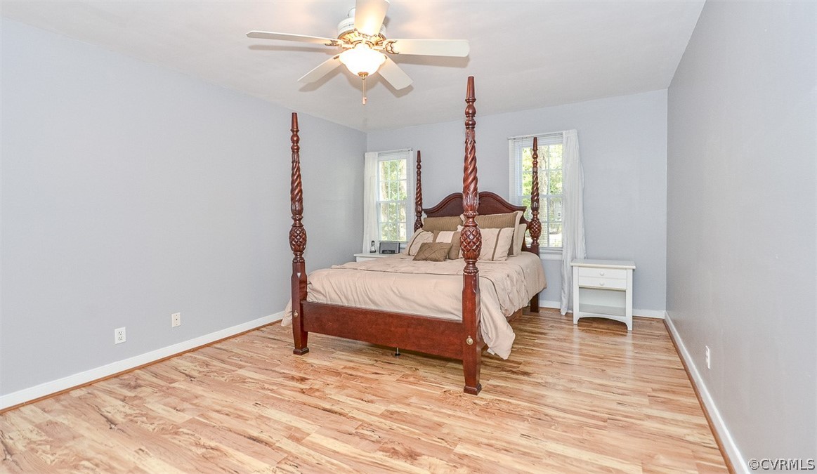 507 Watch Hill Road Midlothian, VA 23114 - Photo 23 of 39 a bedroom with a bed and a chandelier