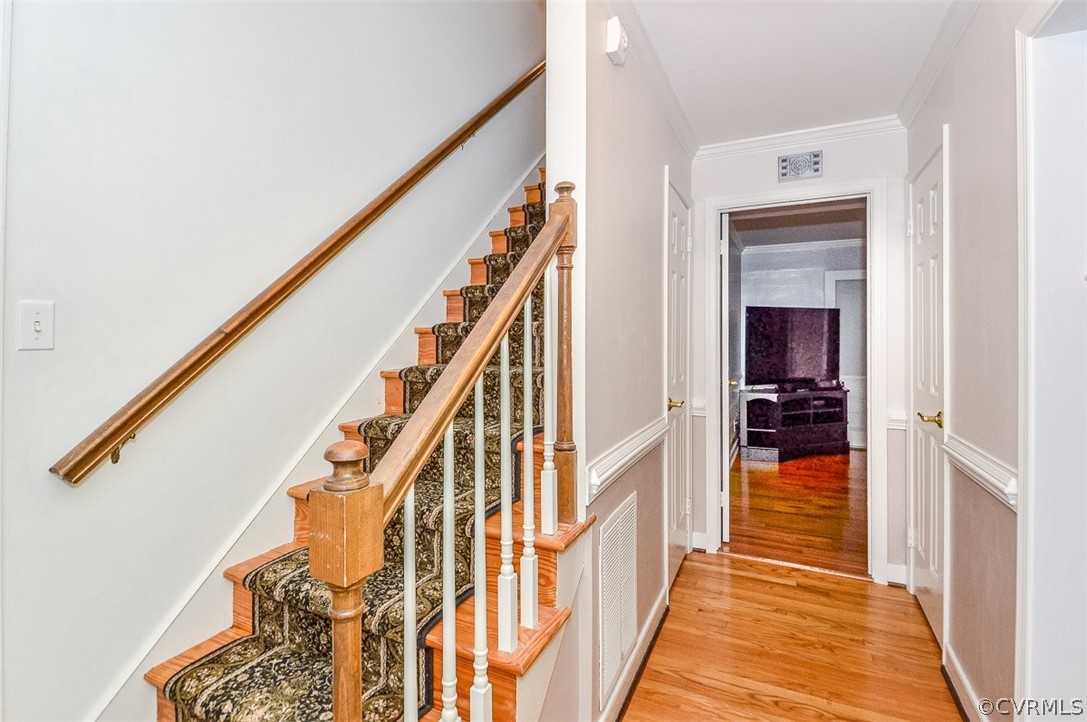 507 Watch Hill Road Midlothian, VA 23114 - Photo 8 of 39 a view of a hallway with wooden floor and staircase