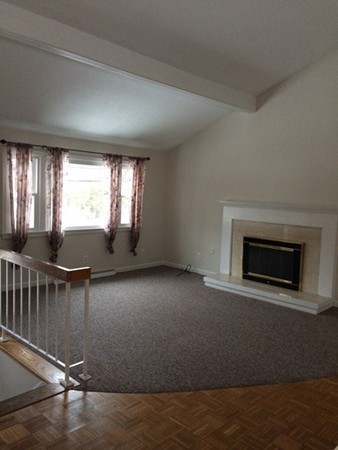 16 Wason Road Hudson, NH 03051 - Photo 14 of 18 an empty room with windows and fireplace