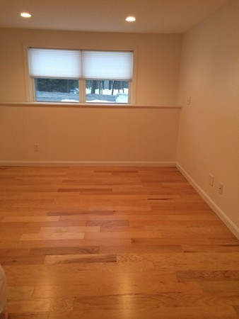 16 Wason Road Hudson, NH 03051 - Photo 10 of 18 a view of a room with an empty space and a window