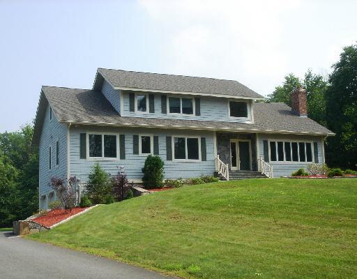 2 Wakeman Hill Road Sherman, CT 06784 - Photo 1 of 1 a front view of a house with a garden