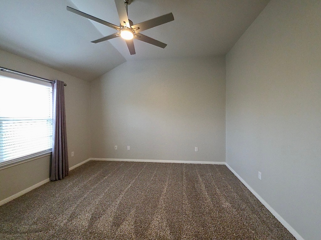 1608 Catalan Road, Unit 302 Austin, TX 78748 - Photo 13 of 21 an empty room with a window and a fan