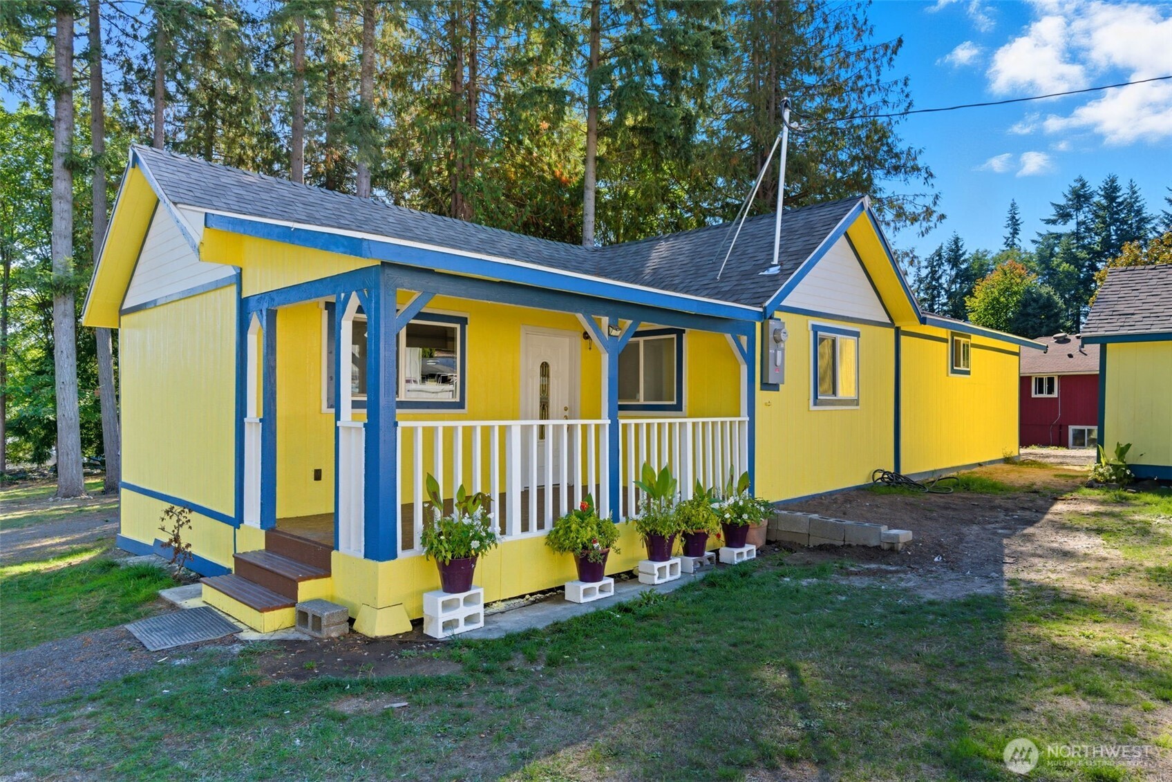 20310 Northwest Cedar Lane Poulsbo, WA 98370 - Photo 1 of 31 a view of a house with backyard and sitting area