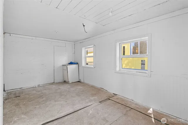 a view of empty room with windows