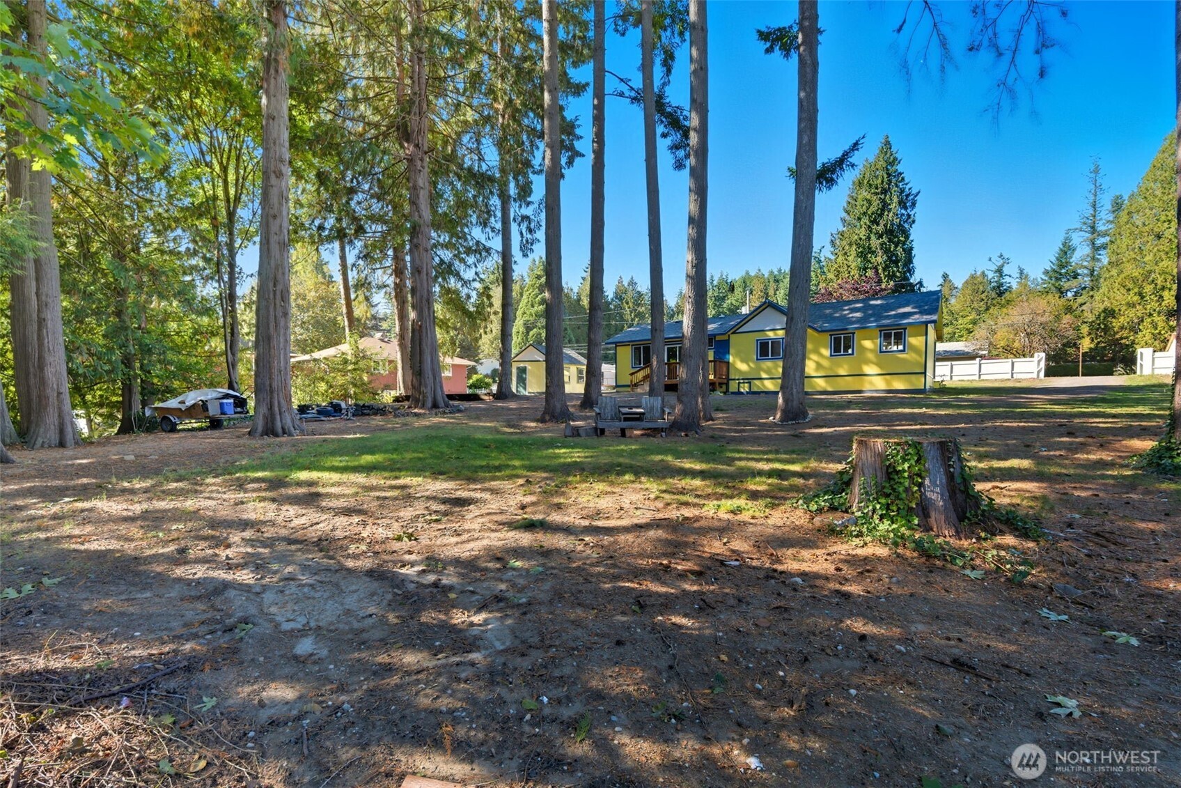 20310 Northwest Cedar Lane Poulsbo, WA 98370 - Photo 15 of 31 a view of a yard with palm tree