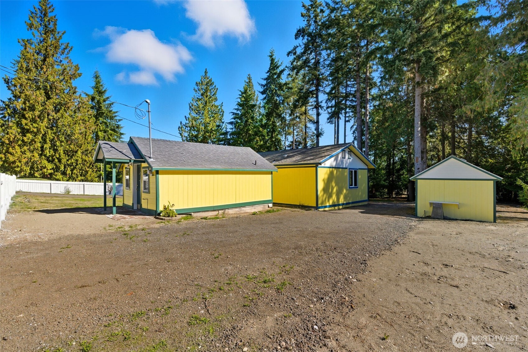 20310 Northwest Cedar Lane Poulsbo, WA 98370 - Photo 17 of 31 a view of a house with a yard and garage