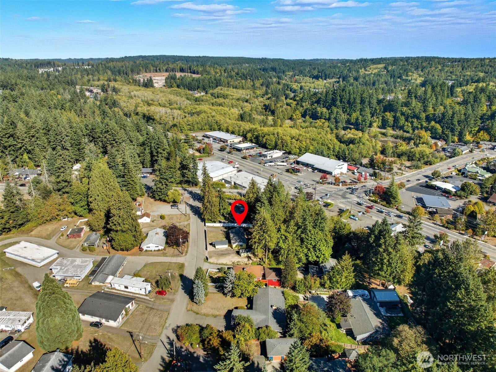 20310 Northwest Cedar Lane Poulsbo, WA 98370 - Photo 22 of 31 an aerial view of residential houses with outdoor space and trees
