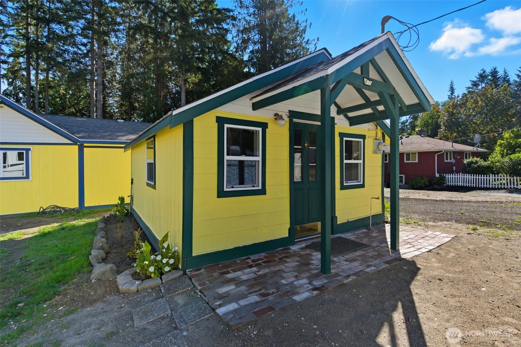 20310 Northwest Cedar Lane Poulsbo, WA 98370 - Photo 29 of 31 a front view of a house with garden