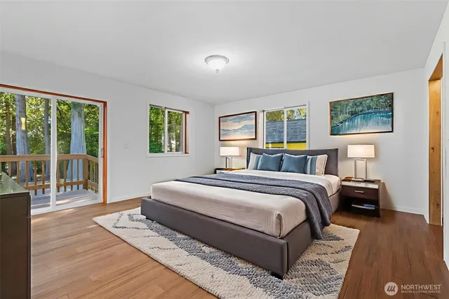 a bedroom with a large bed and a window