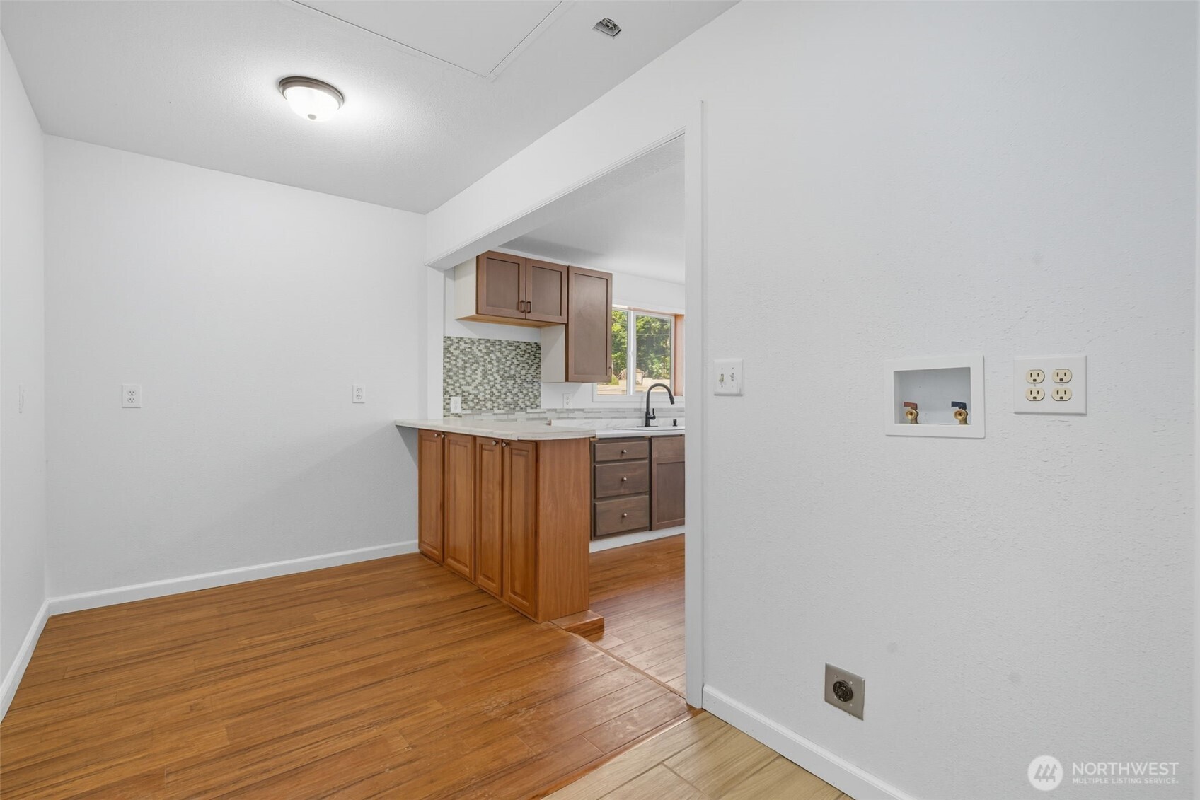 20310 Northwest Cedar Lane Poulsbo, WA 98370 - Photo 5 of 31 a view of kitchen with wooden floor