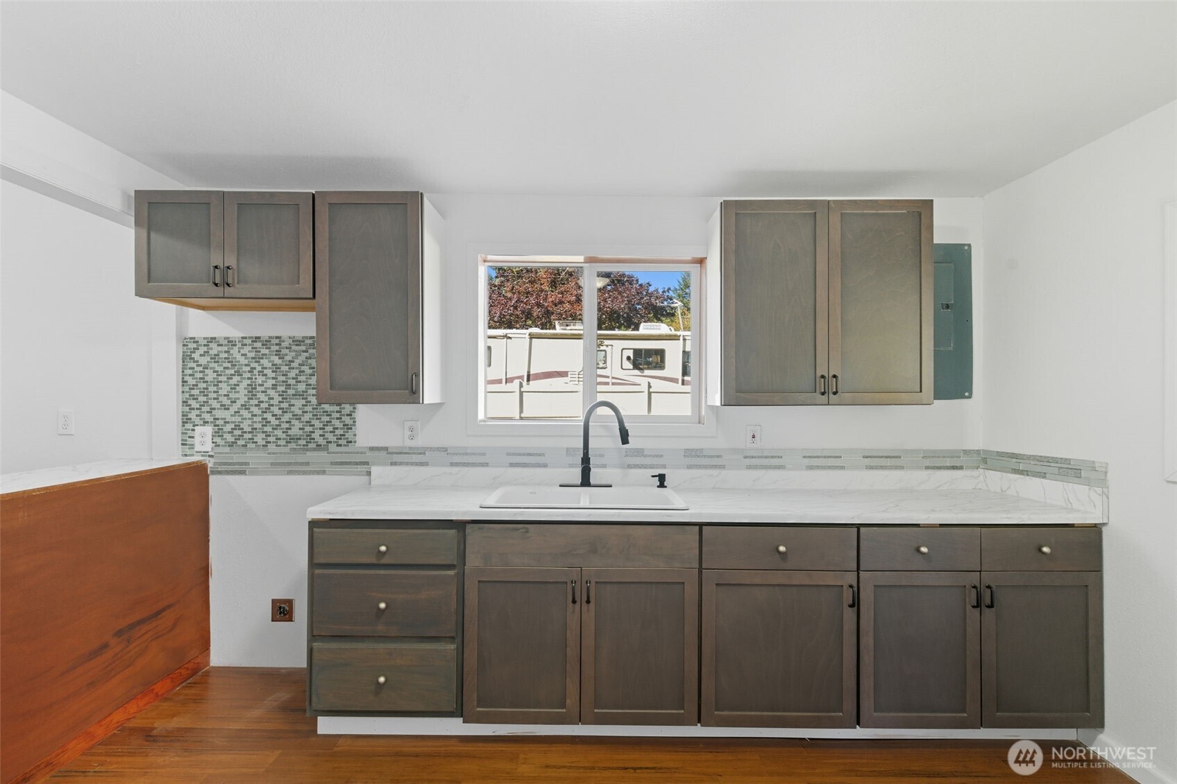 20310 Northwest Cedar Lane Poulsbo, WA 98370 - Photo 7 of 31 a bathroom with a sink and a mirror