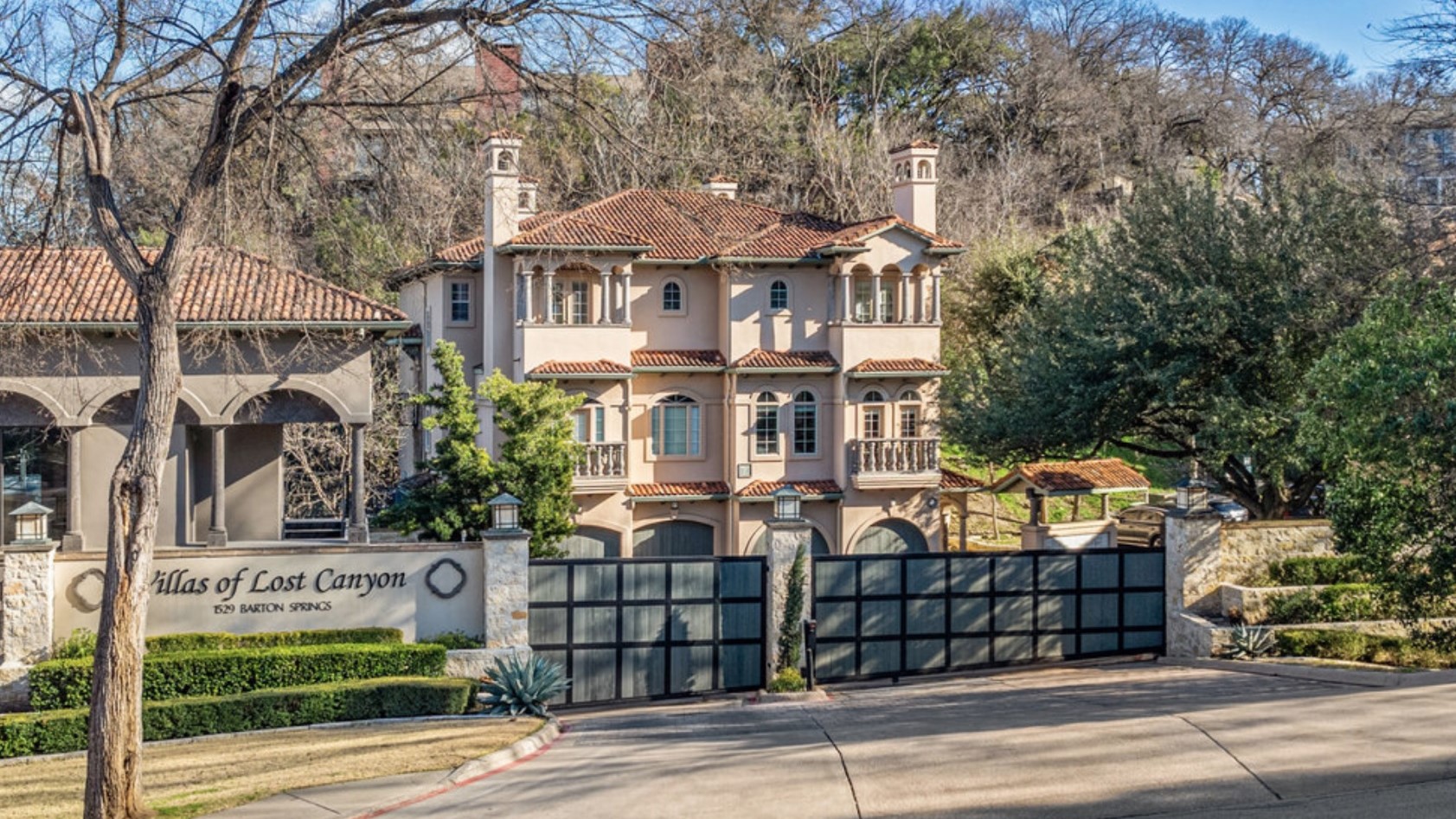 a view of a white building among the street and building