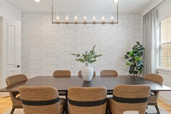 a dining room with furniture and window