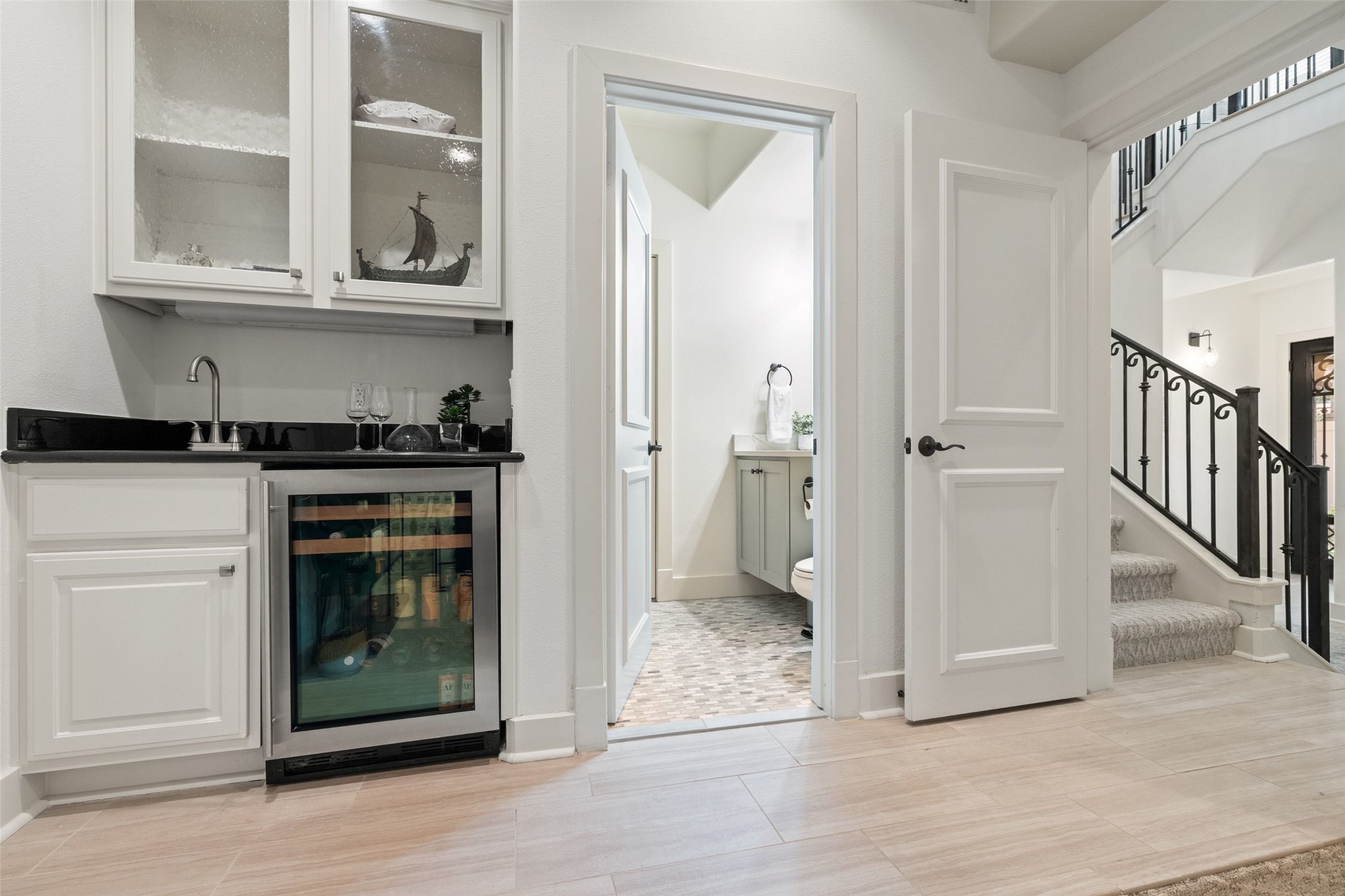 1529 Barton Springs Road, Unit 2 Austin, TX 78704 - Photo 22 of 40 a view of a kitchen with white cabinets and a fireplace