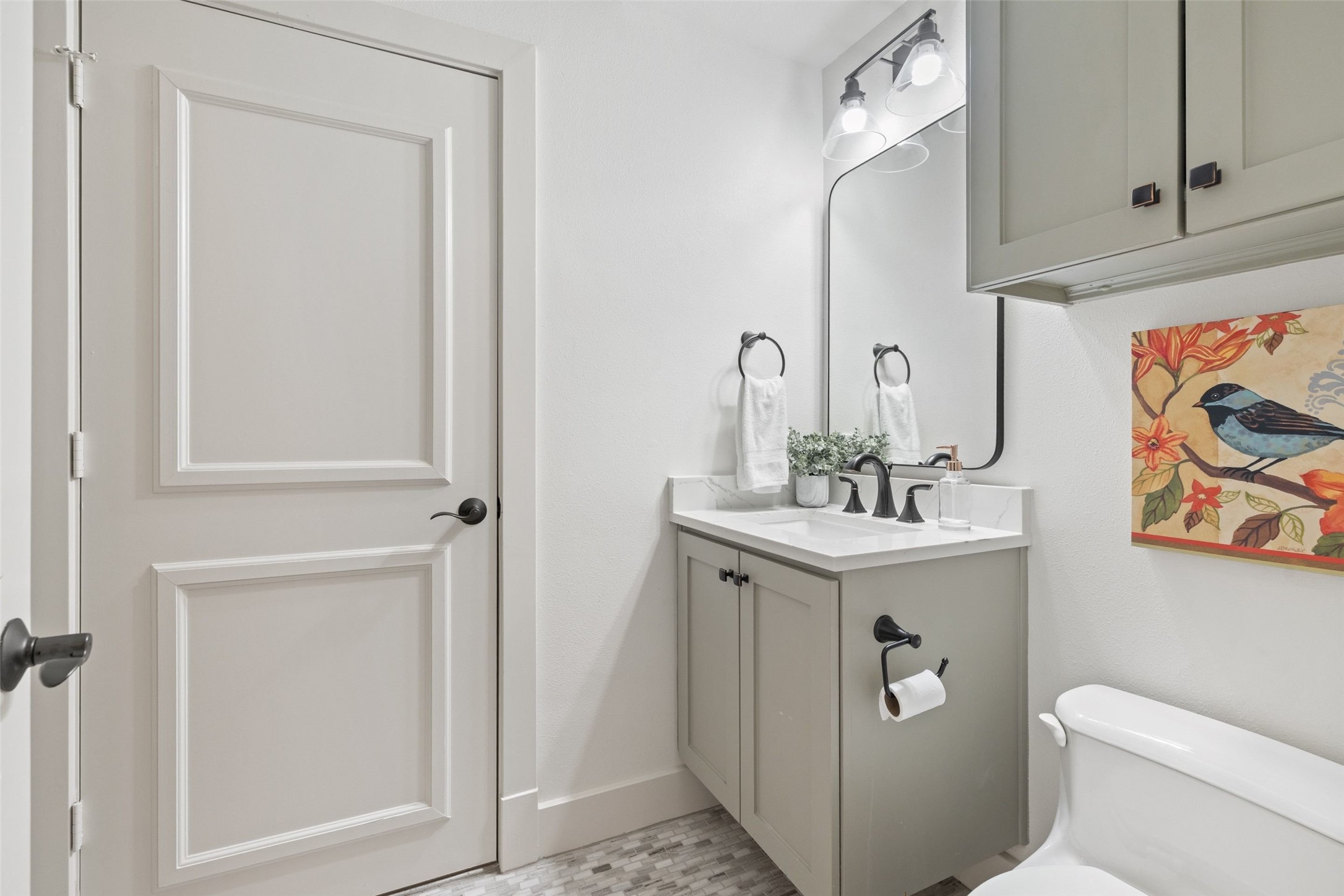 1529 Barton Springs Road, Unit 2 Austin, TX 78704 - Photo 23 of 40 a bathroom with a sink a toilet and vanity