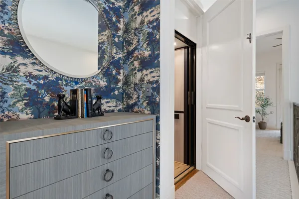 a bedroom with a large bed and windows