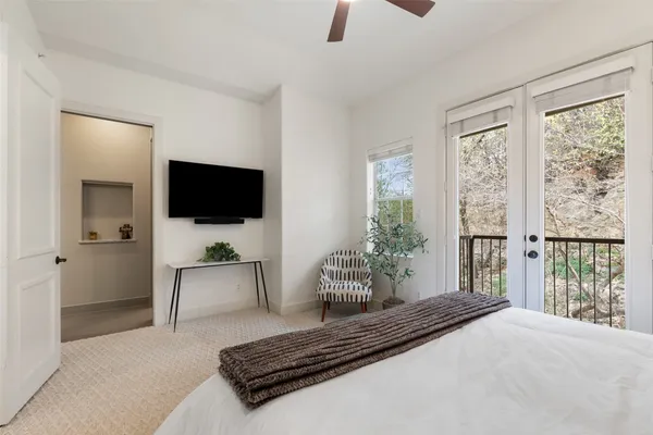 a spacious bathroom with a tub shower sink and mirror