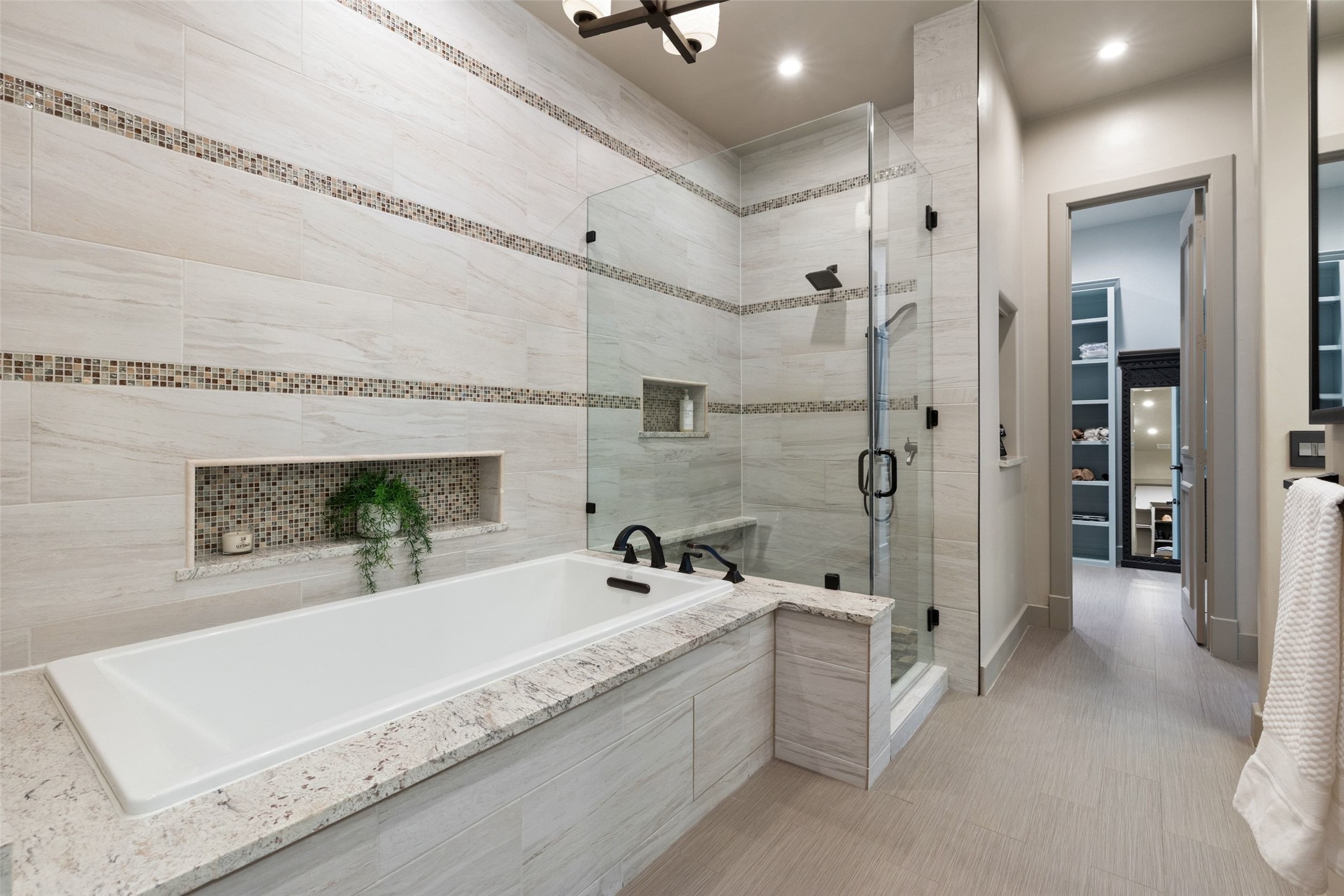1529 Barton Springs Road, Unit 2 Austin, TX 78704 - Photo 28 of 40 a spacious bathroom with a tub shower sink and mirror