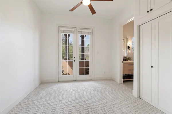 a view of a balcony with table and chairs