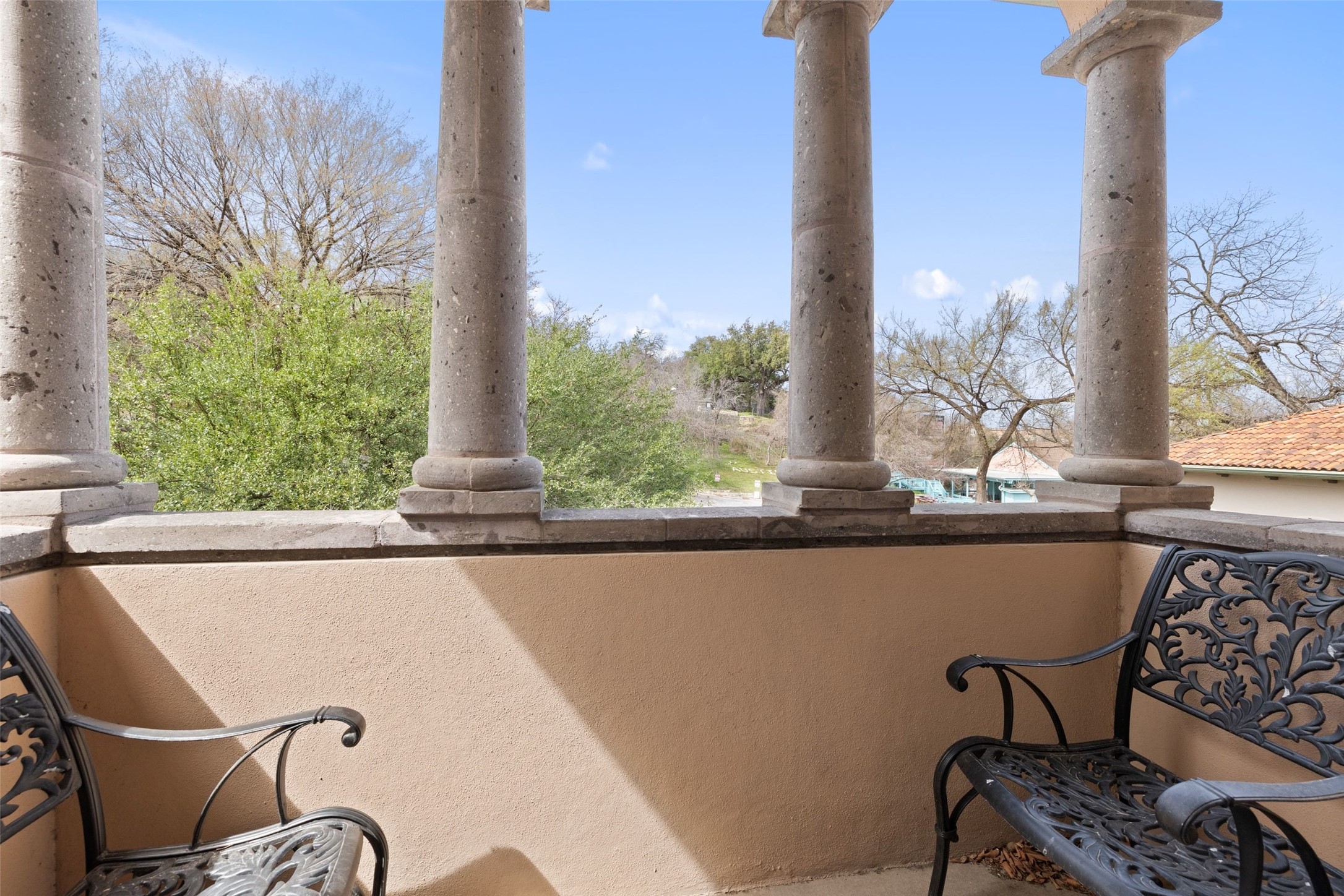 1529 Barton Springs Road, Unit 2 Austin, TX 78704 - Photo 33 of 40 a view of a balcony with table and chairs