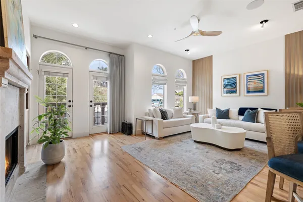 a living room with furniture and a potted plant