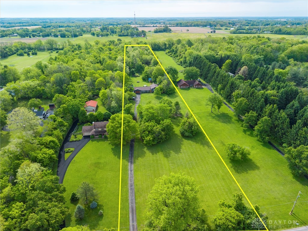 2165 Stewart Road Xenia, OH 45385 - Photo 27 of 59 Expansive green property showcasing natural beauty and serene surroundings with residential structures.