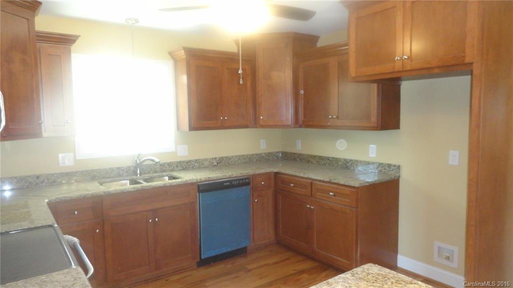 4759 Kemp Dellinger Road, Unit 1 Maiden, NC 28650 - Photo 18 of 24 a kitchen with a sink a cabinets and window