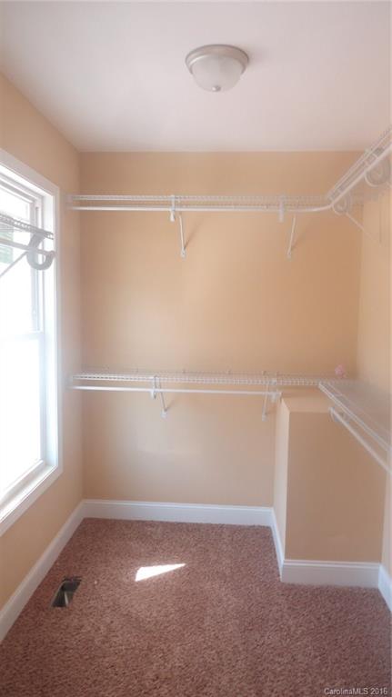 4759 Kemp Dellinger Road, Unit 1 Maiden, NC 28650 - Photo 19 of 24 a view of a room with racks on the wall